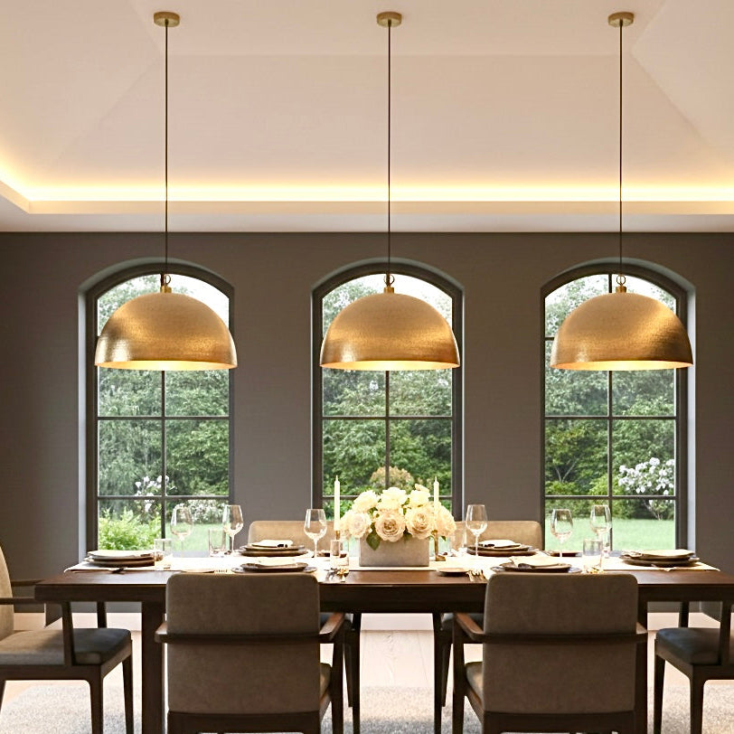 Large modern dome light fixture above a dining table in a minimalist dining room.
