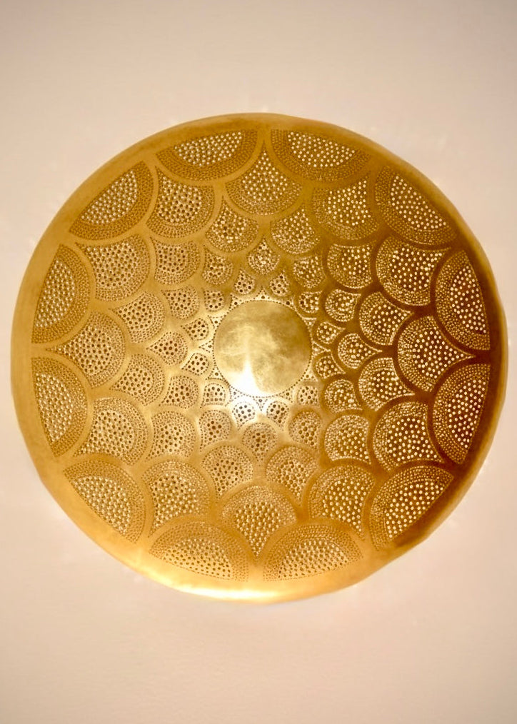 Traditional handmade Moroccan wall lamp made of solid brass with intricate hand-pierced patterns.