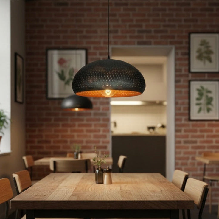 Decorative black dome hanging lamp for kitchen island or dining room.