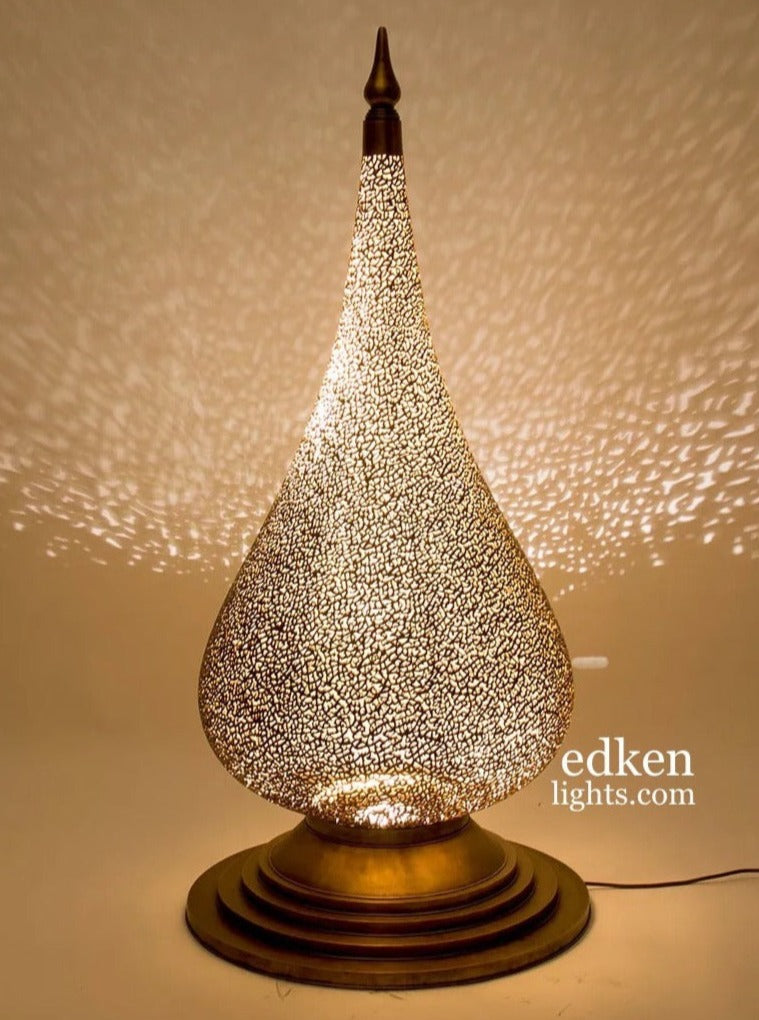 Large handmade Moroccan brass table lamp with teardrop design and intricate shadow patterns.