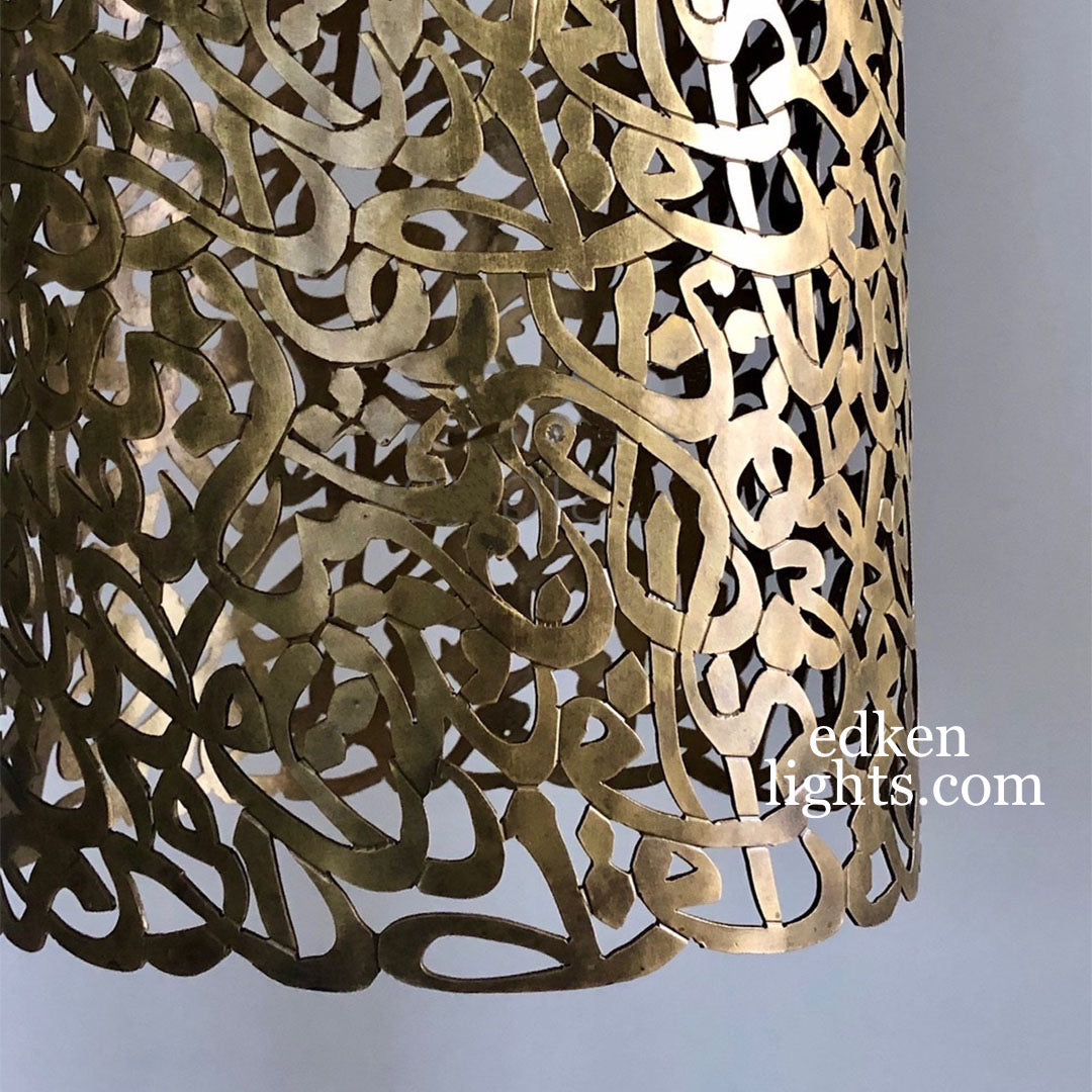 Detail of the black cord and high-quality brass finish of a Moroccan hanging light fixture for modern luxury homes.