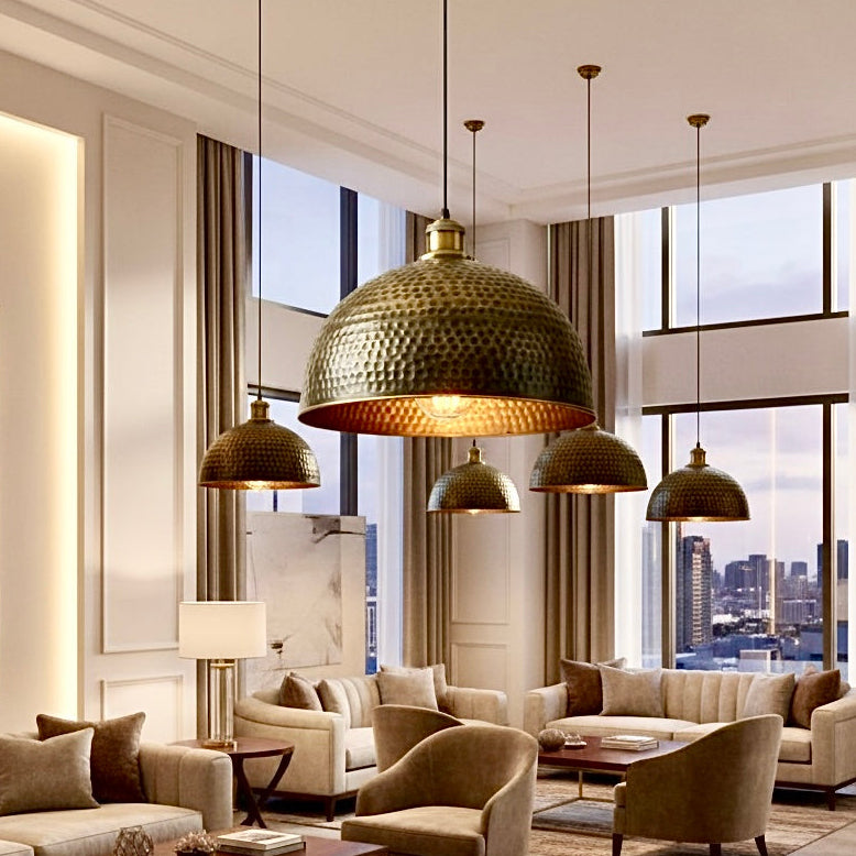 Multiple hammered bronze lamps styled in a high-ceiling luxury living room, wholesale bulk orders welcome.