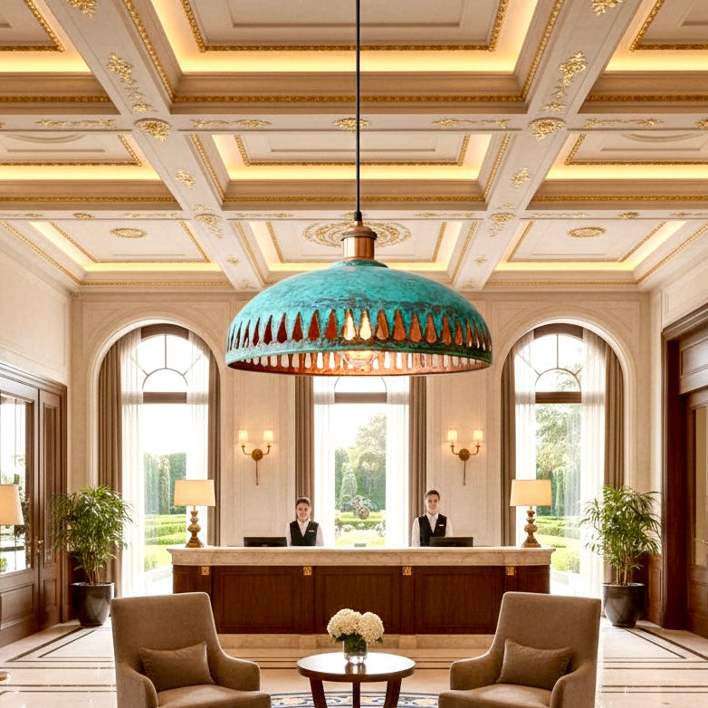 Large copper dome chandelier with green patina in a luxury hotel lobby.