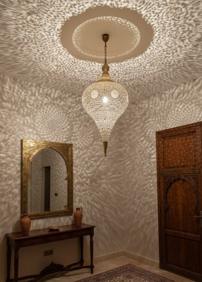Luxury Moroccan brass pendant light, artisan-crafted for high-end interior design projects globally.