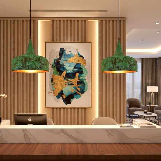 Pair of handmade Moroccan brass dome lights with green patina installed in a luxury office reception area with wood paneling.