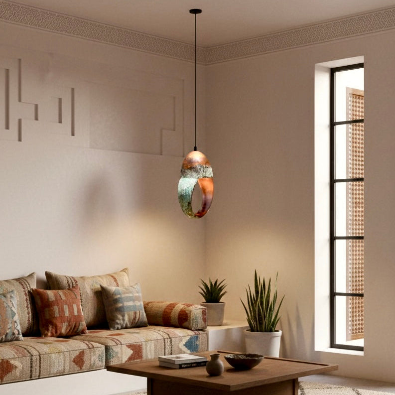 Close-up of the natural green oxidation and hand-hammered red copper inside the ring lamp.