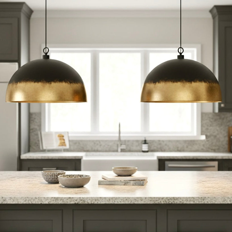 Minimalist gold brass dome lamp installed in a modern Scandinavian style living room.