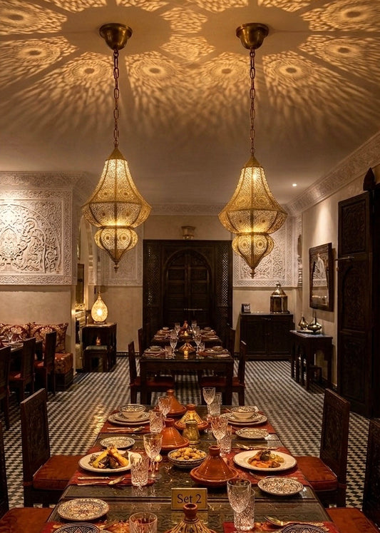 Large Moroccan brass chandelier in a modern high-ceiling living room with contemporary furniture and architectural arches.