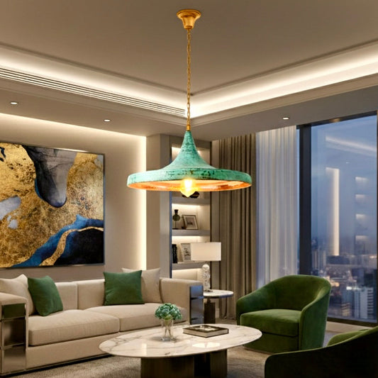 Modern hammered brass dome lamp with green patina in a luxury living room with abstract art, perfect for high-end interior design.