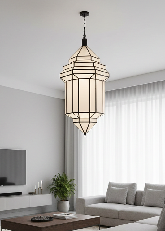 Large white glass and handmade brass Moroccan pendant light hanging in a minimalist modern living room.