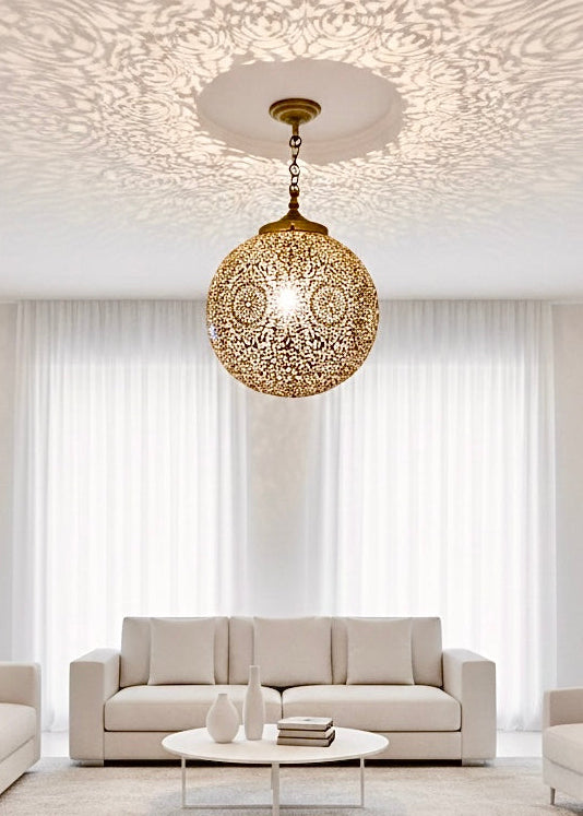 Minimalist modern living room featuring a brass handmade Moroccan hanging lamps for a bohemian touch.