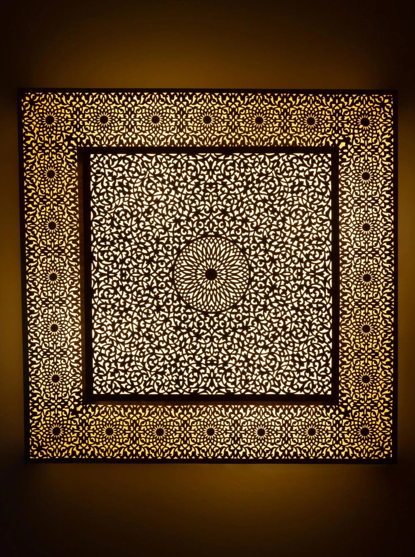 Handcrafted Moroccan brass ceiling lamp with intricate geometric perforation.