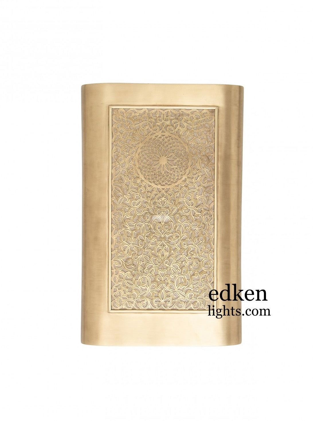 Close-up of a hand-engraved Arabesque pattern on a golden brass Moroccan light fixture.