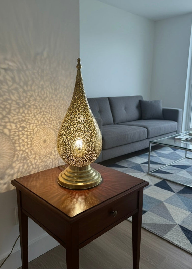Intricate shadow patterns cast by a pierced Moroccan brass lantern 
