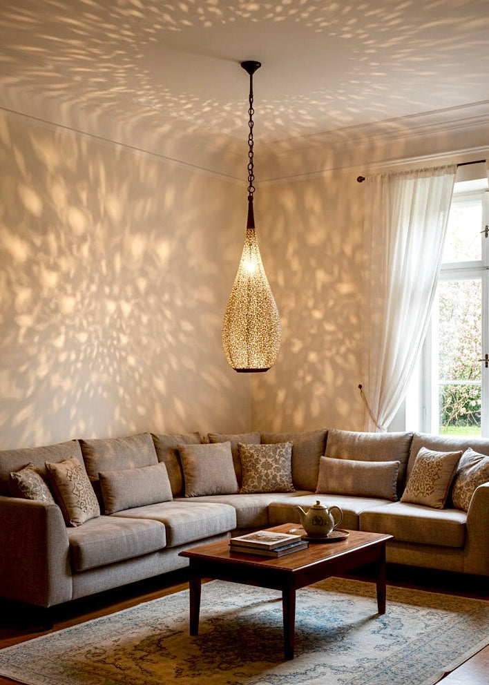 Stunning shadow patterns on the wall created by a handmade Moroccan brass pendant lamp.