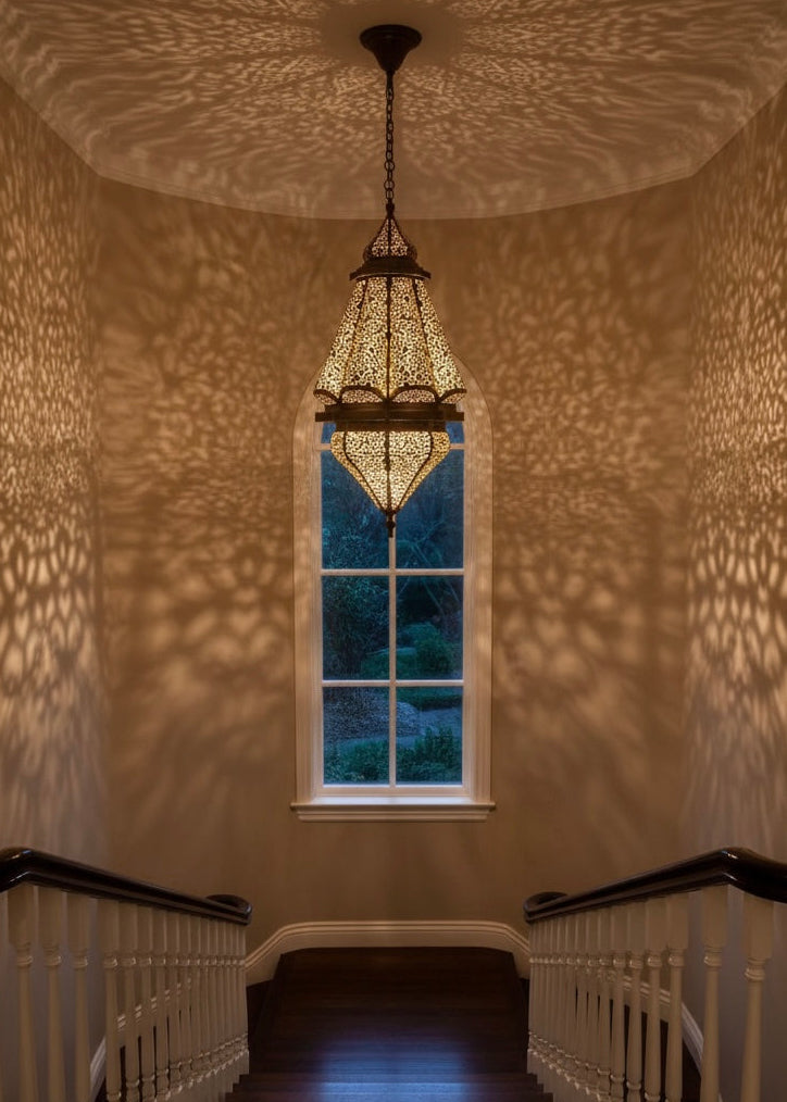 Warm ambient lighting with beautiful shadow patterns from a Moroccan brass chandelier.