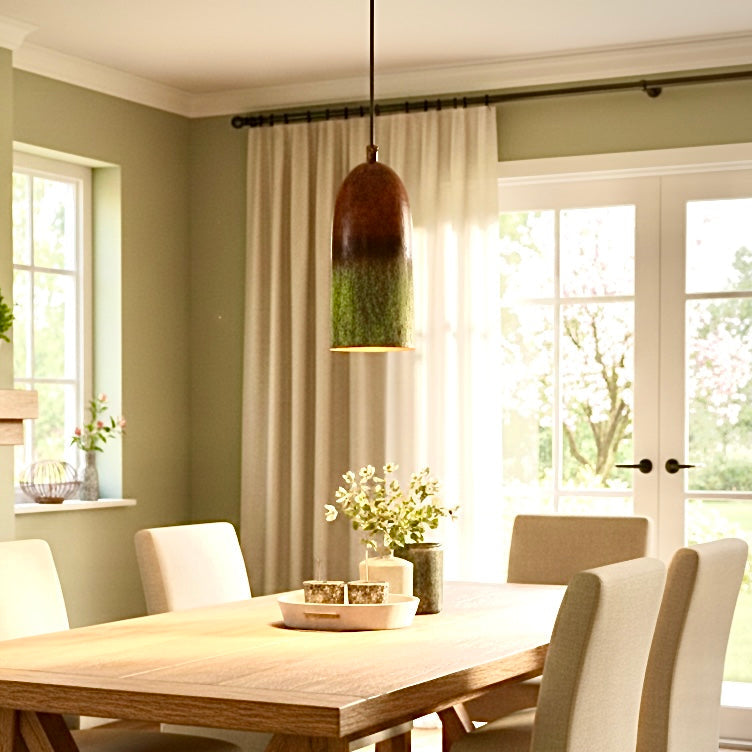 Modern Moroccan brass hanging lamp illuminating a contemporary dining room with wooden furniture.