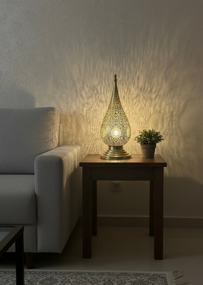 Handcrafted Moroccan brass table lamp with a traditional teardrop design and intricate filigree patterns.