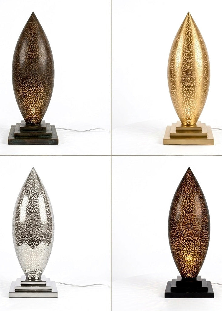 Four variations of the handmade Moroccan brass table lamp showing available finishes: antique bronze, brushed gold, polished silver, and matte black.⁠
