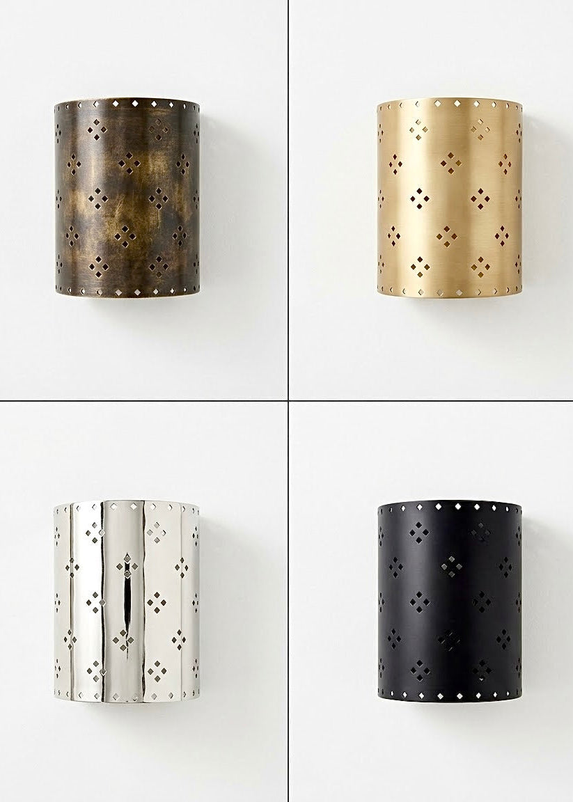 Handcrafted Moroccan cylinder wall sconce available in four custom finishes: antique bronze, brushed brass, silver chrome, and matte black.