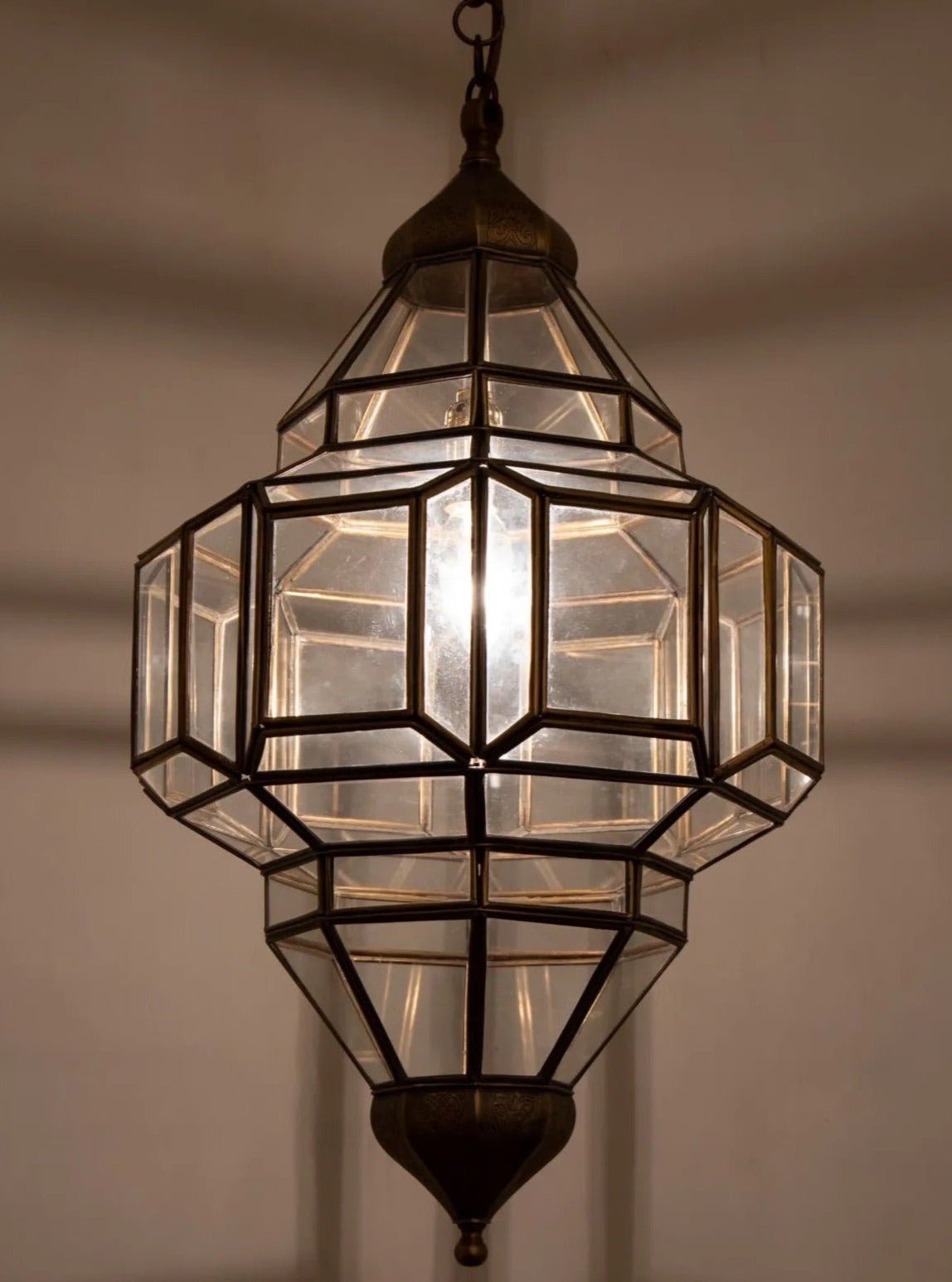 Handcrafted Moroccan ceiling glass lamp made of authentic brass with geometric patterns.