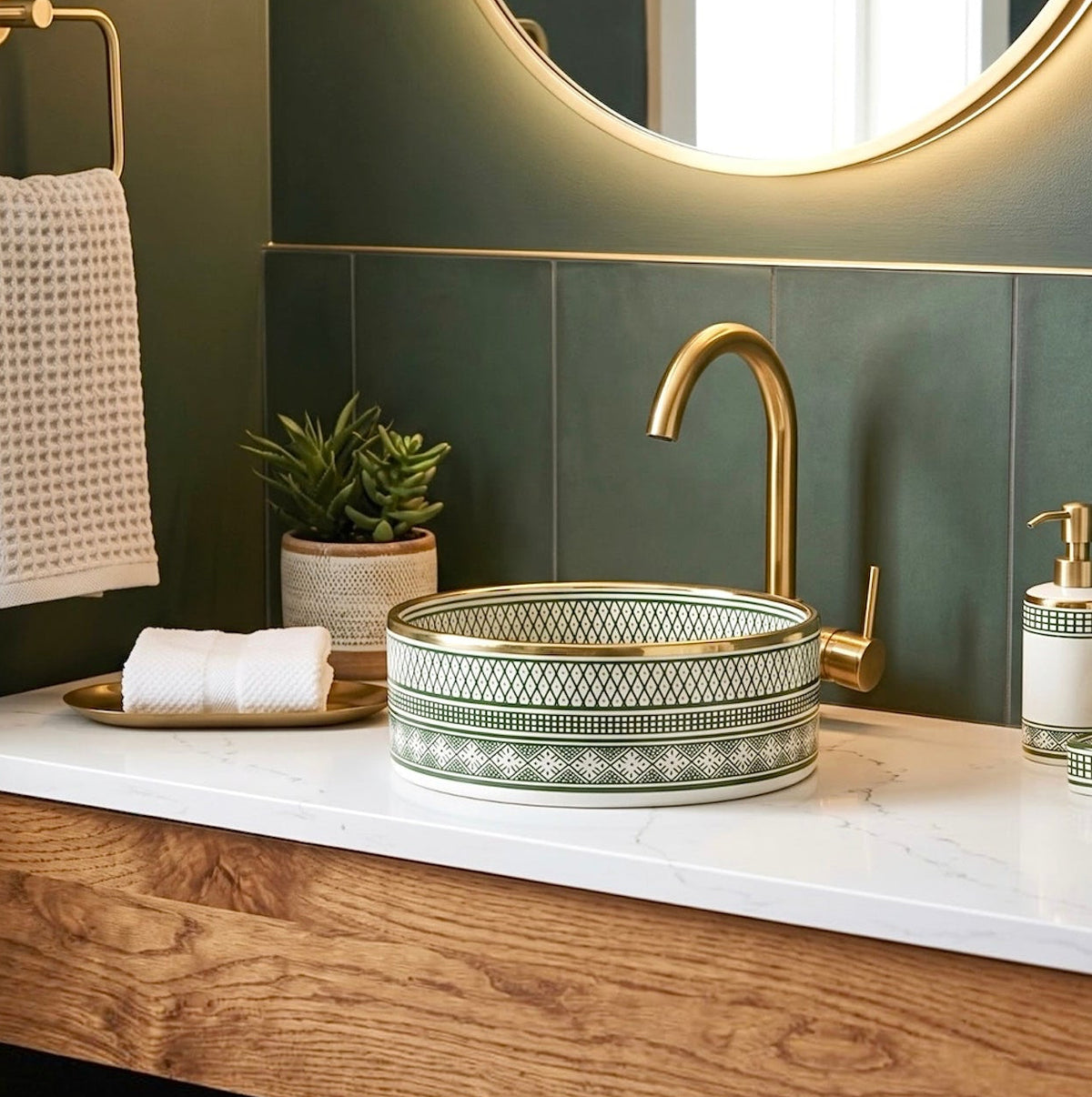 Handmade Moroccan ceramic vessel sink with brass rim installed on rustic wooden vanity inside traditional Moroccan riad bathroom.