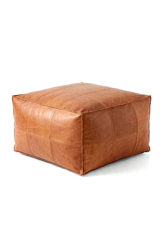 Handmade light brown square Moroccan leather pouf with detailed hand stitching on a white background⁠