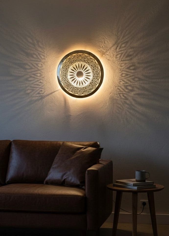 Decorative Moroccan shadow lamp creating beautiful geometric light patterns on the wall for a cozy atmosphere.