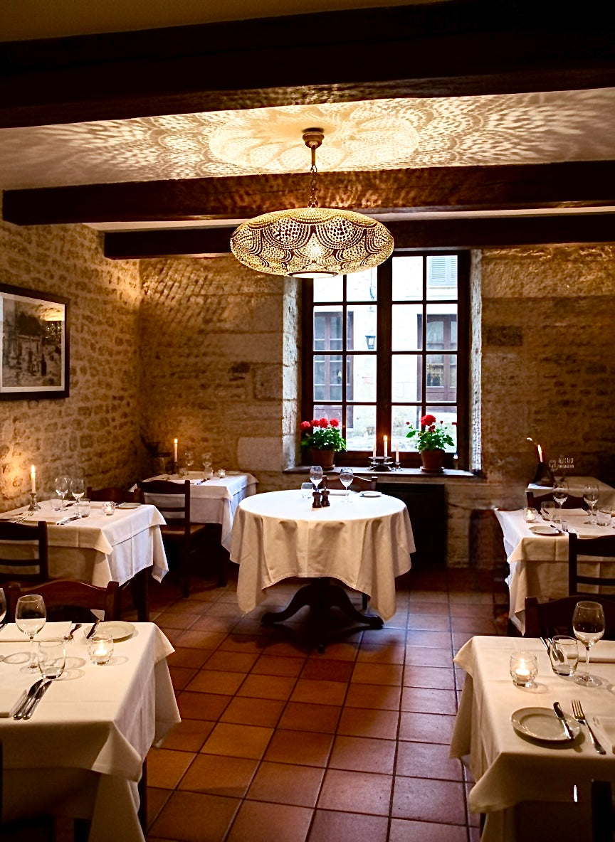 Authentic Moroccan brass chandelier in a luxury oriental restaurant setting, perfect for Majlis and Middle Eastern interior design.