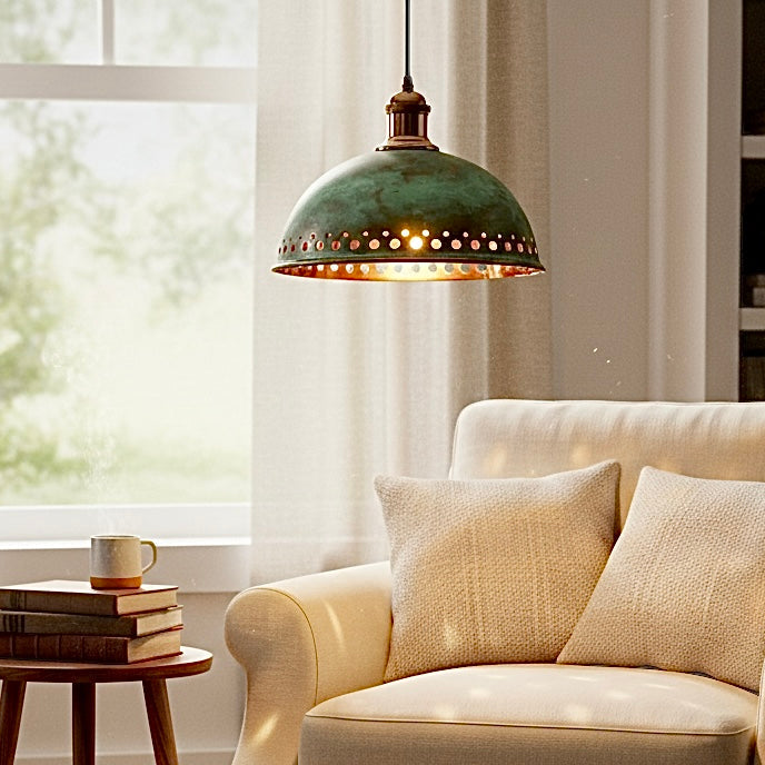 Modern interior featuring oxidized brass pendant lights with green patina finish and golden inner glow for a sophisticated atmosphere.