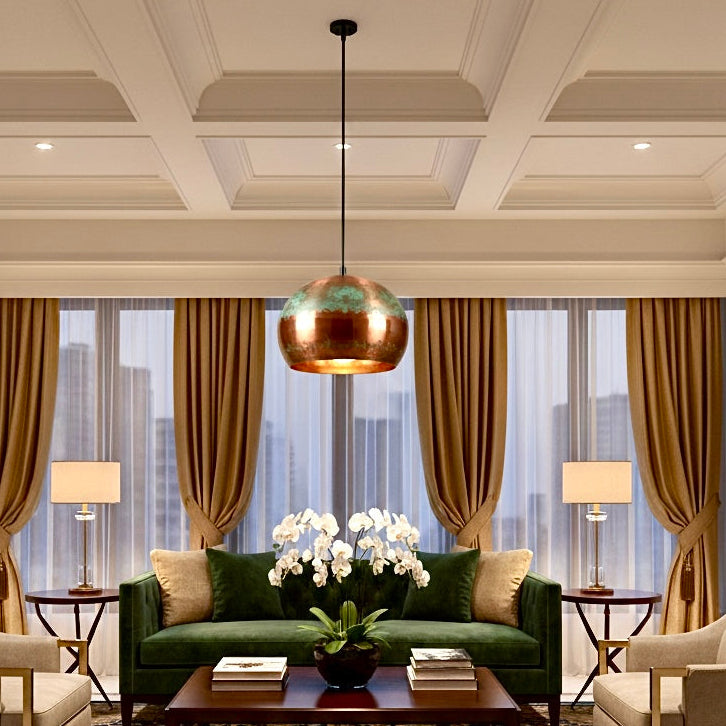 Luxury oxidized copper dome pendant light installed in a modern living room setting.