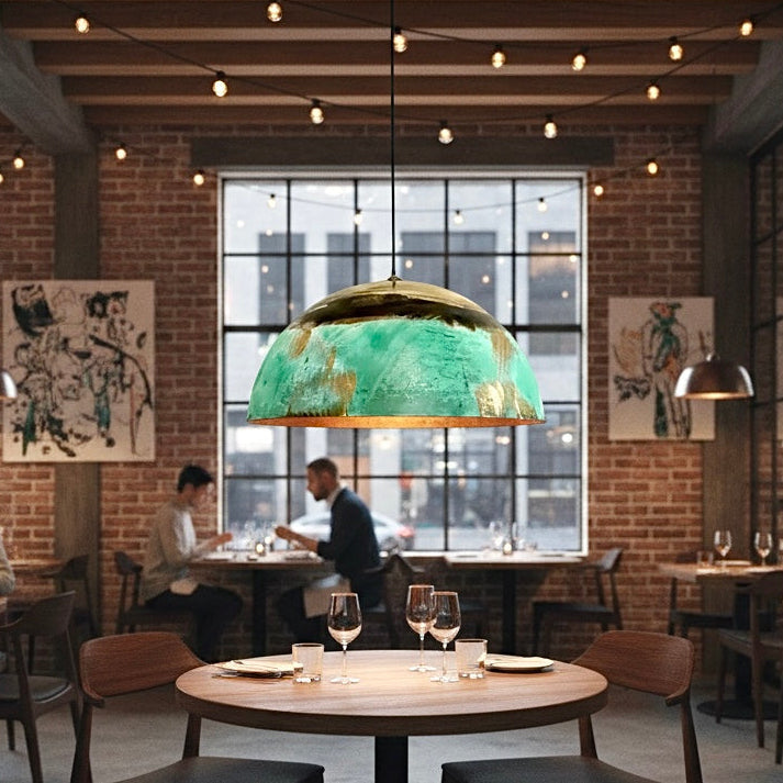Restaurant lighting featuring green patina and gold dome pendants for a cozy ambiance.