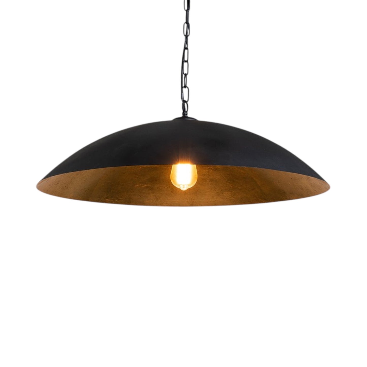 Minimalist Scandinavian hanging lamp in black and gold used as a focal point in a modern home interior.