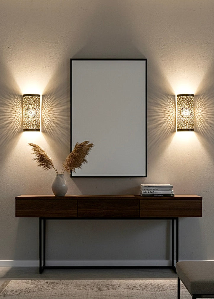 Set of 2 handmade Moroccan wall lamps in polished gold brass with intricate perforations.