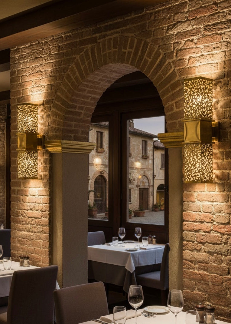 A vertical rectangular wall lamp handcrafted from high-quality solid brass with a polished gold finish.