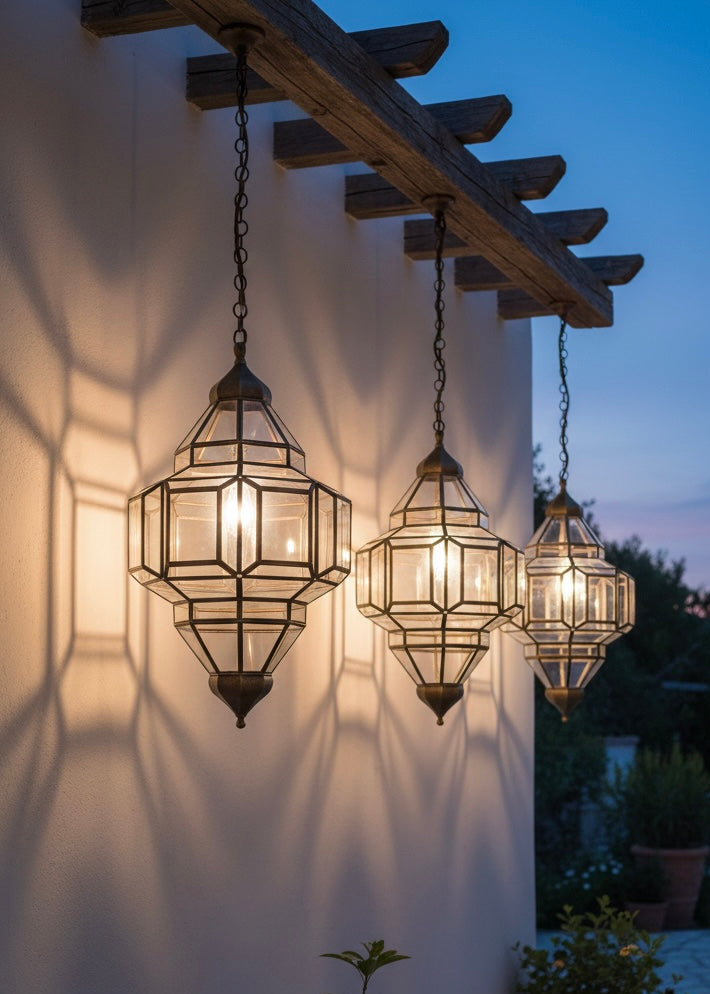 Elegant Moroccan brass and glass lantern providing warm ambient ceiling lighting.