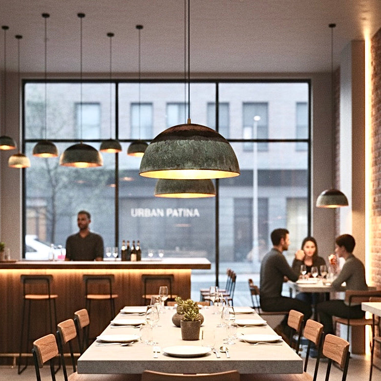 Urban patina brass dome light fixture in a contemporary restaurant dining area.