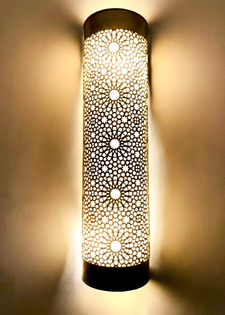 Elegant brass wall sconce in Moroccan style for living room decor.