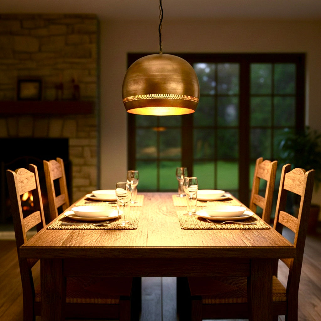 Warm gold brass hanging light fixture for modern dining room decor.