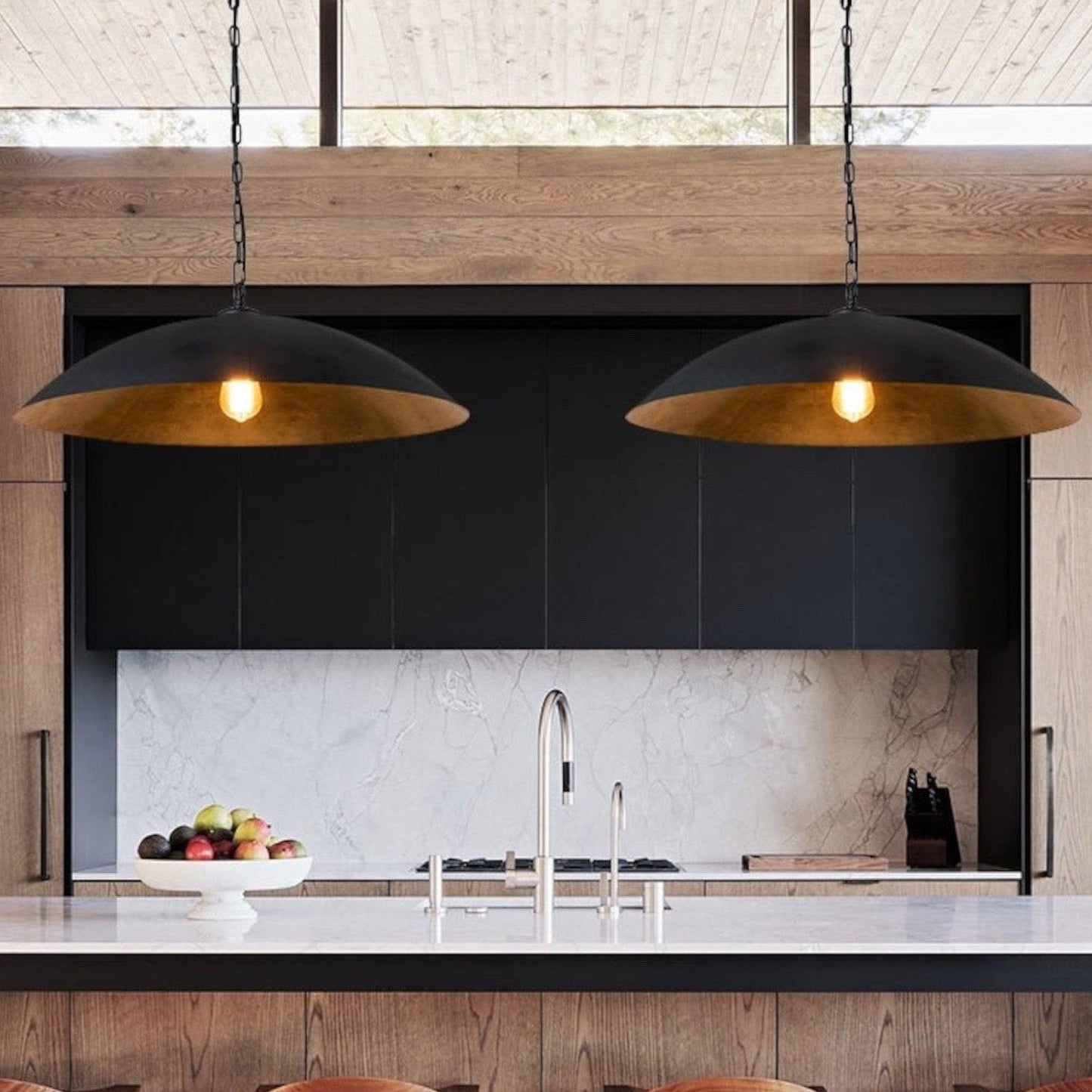 Vintage style black dome pendant light with a textured gold interior for warm ambient lighting.