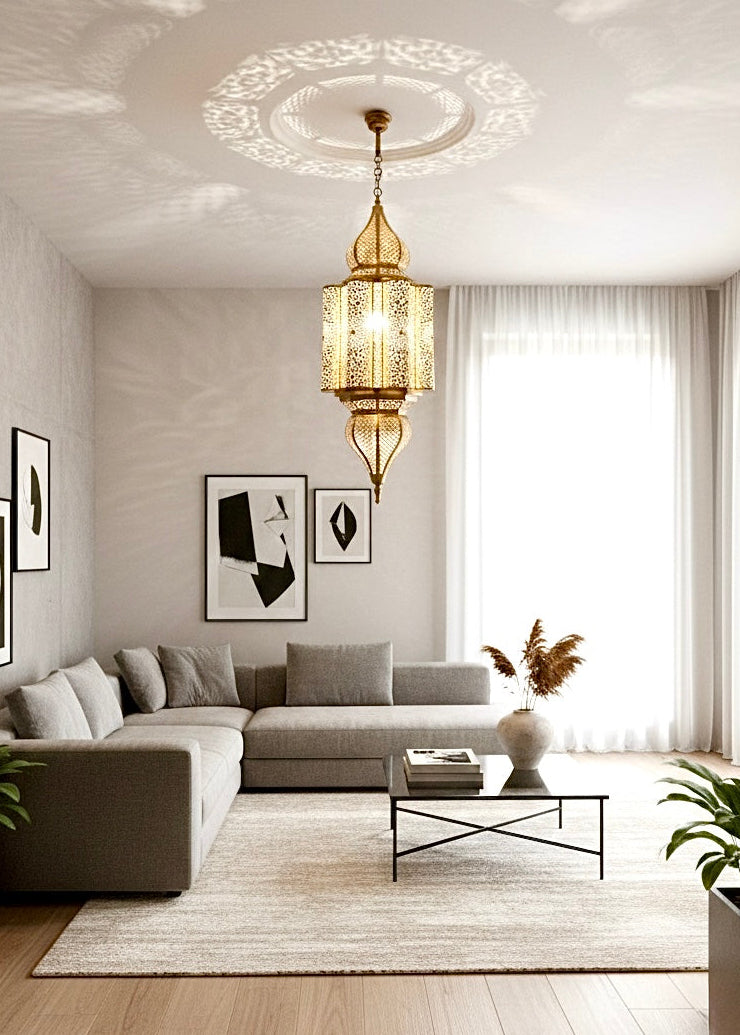 Artisan brass pendant lighting collection in various shapes: teardrop, cylinder, and globe.