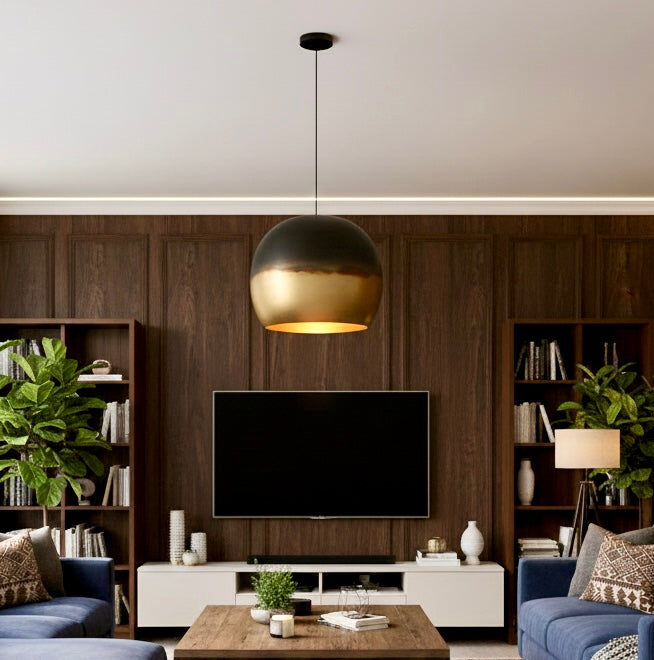 The interior view of a brass dome lamp reflecting warm light across a contemporary living space.