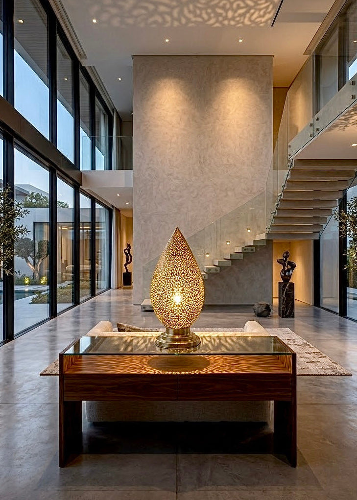 Large brass Moroccan teardrop table lamp centerpiece in a luxury villa foyer, customizable for wholesale and trade interior projects