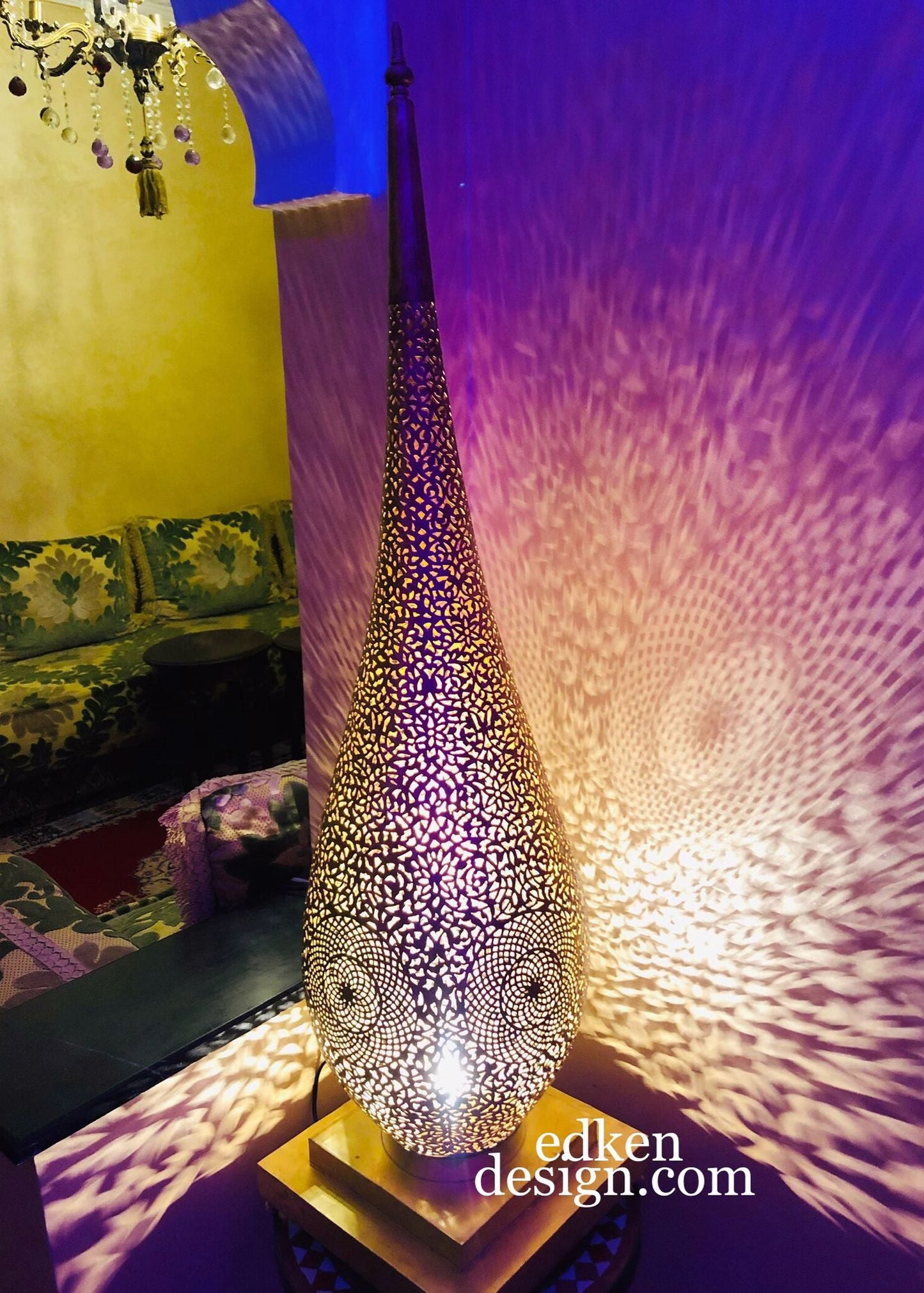Handcrafted Moroccan brass floor lamp with intricate filigree patterns.