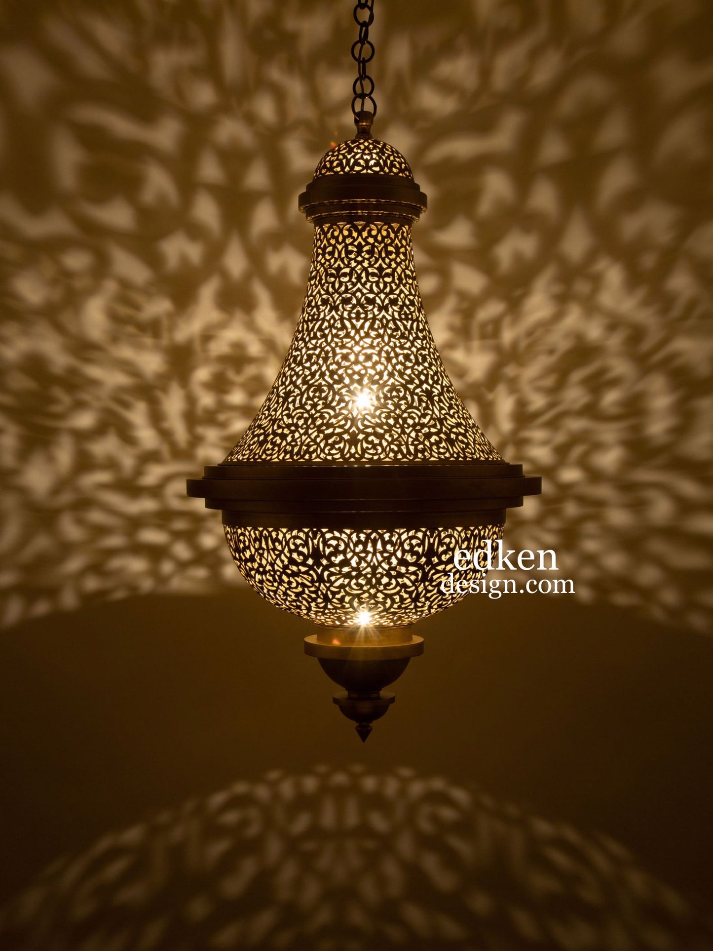 Moroccan brass lamp casting intricate geometric shadow patterns on walls, warm golden ambient lighting.