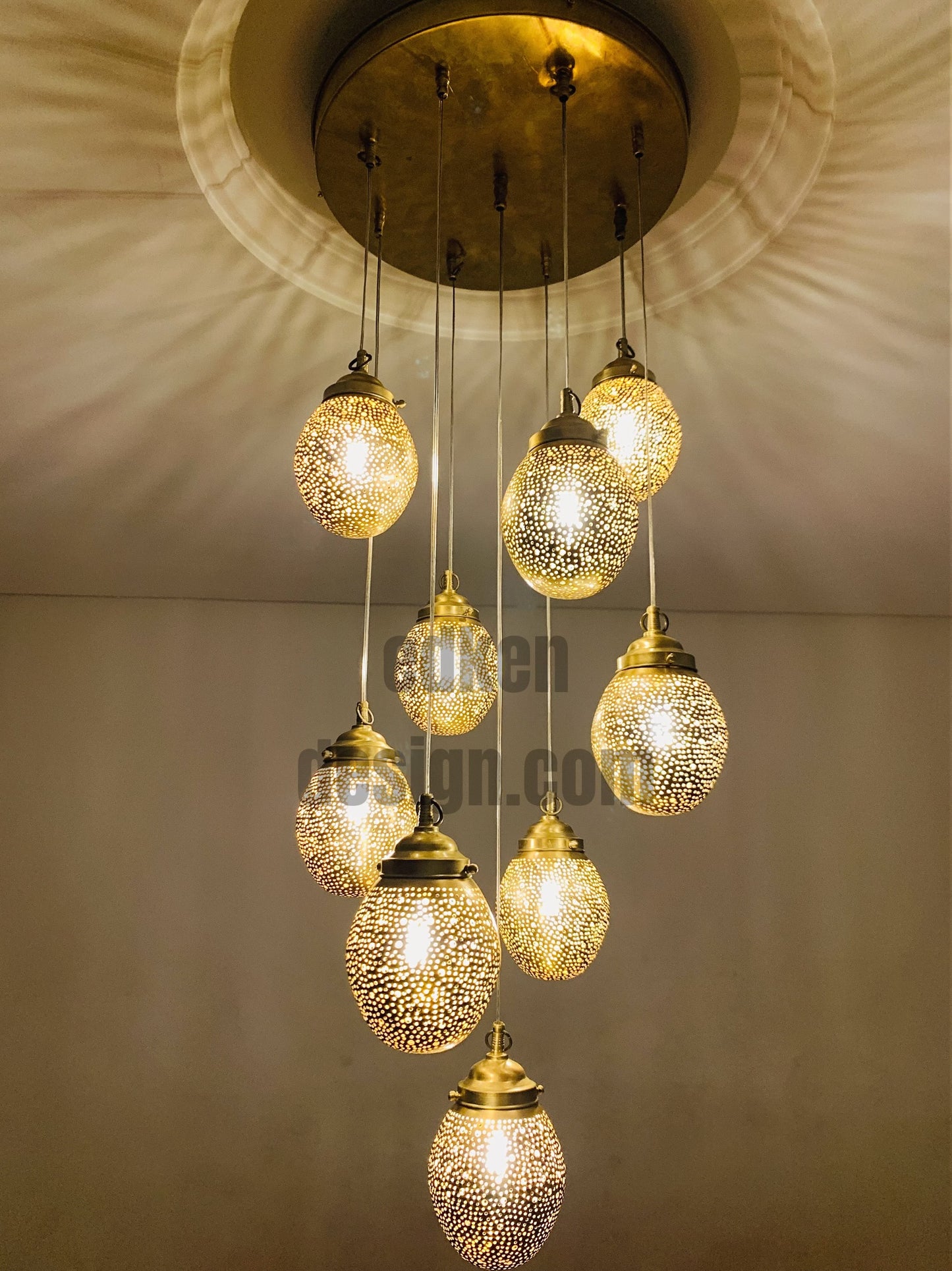 Authentic Moroccan multi-light pendant fixture installed in a modern living room for bohemian style.